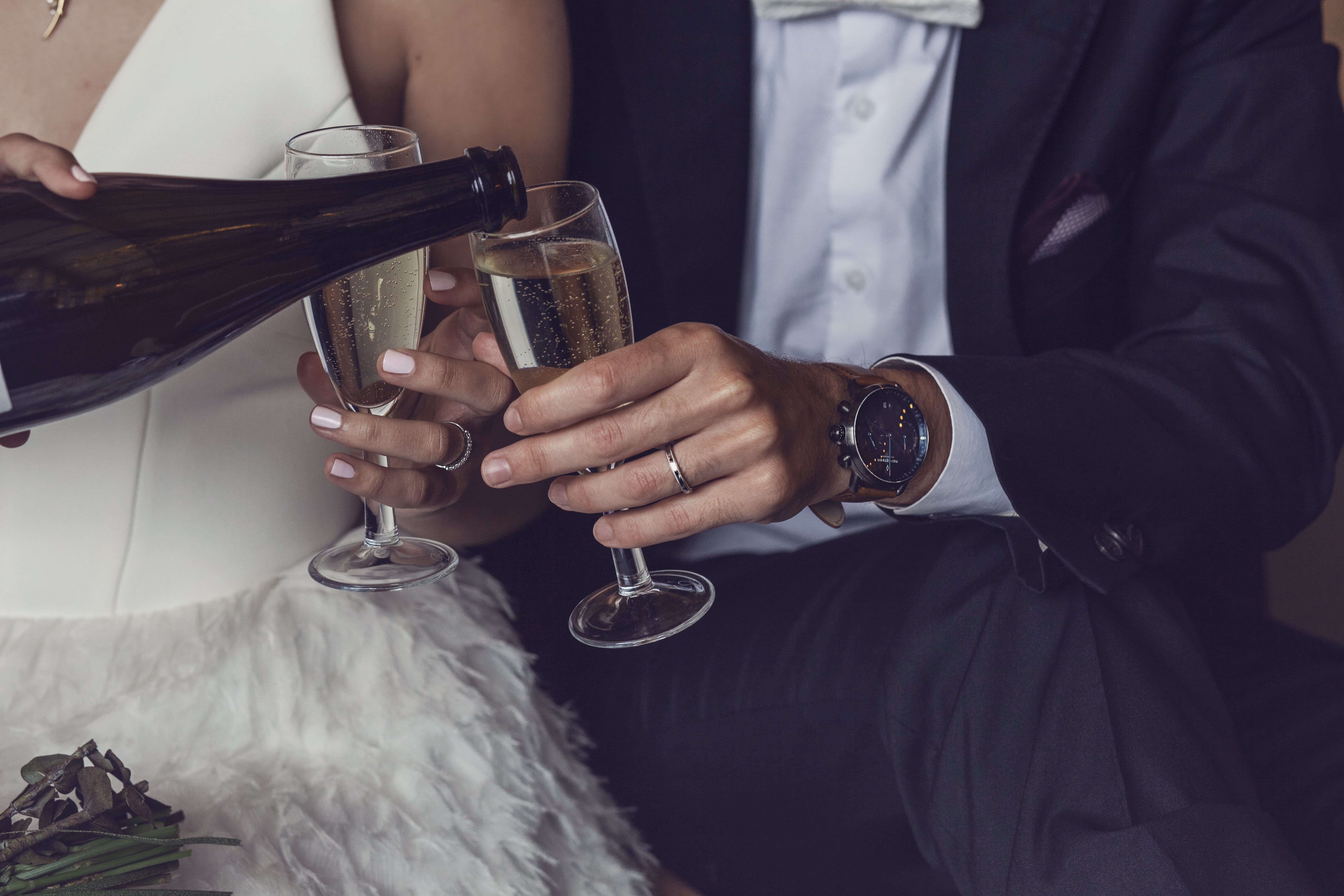 Bride & Groom Pouring Some Champagne