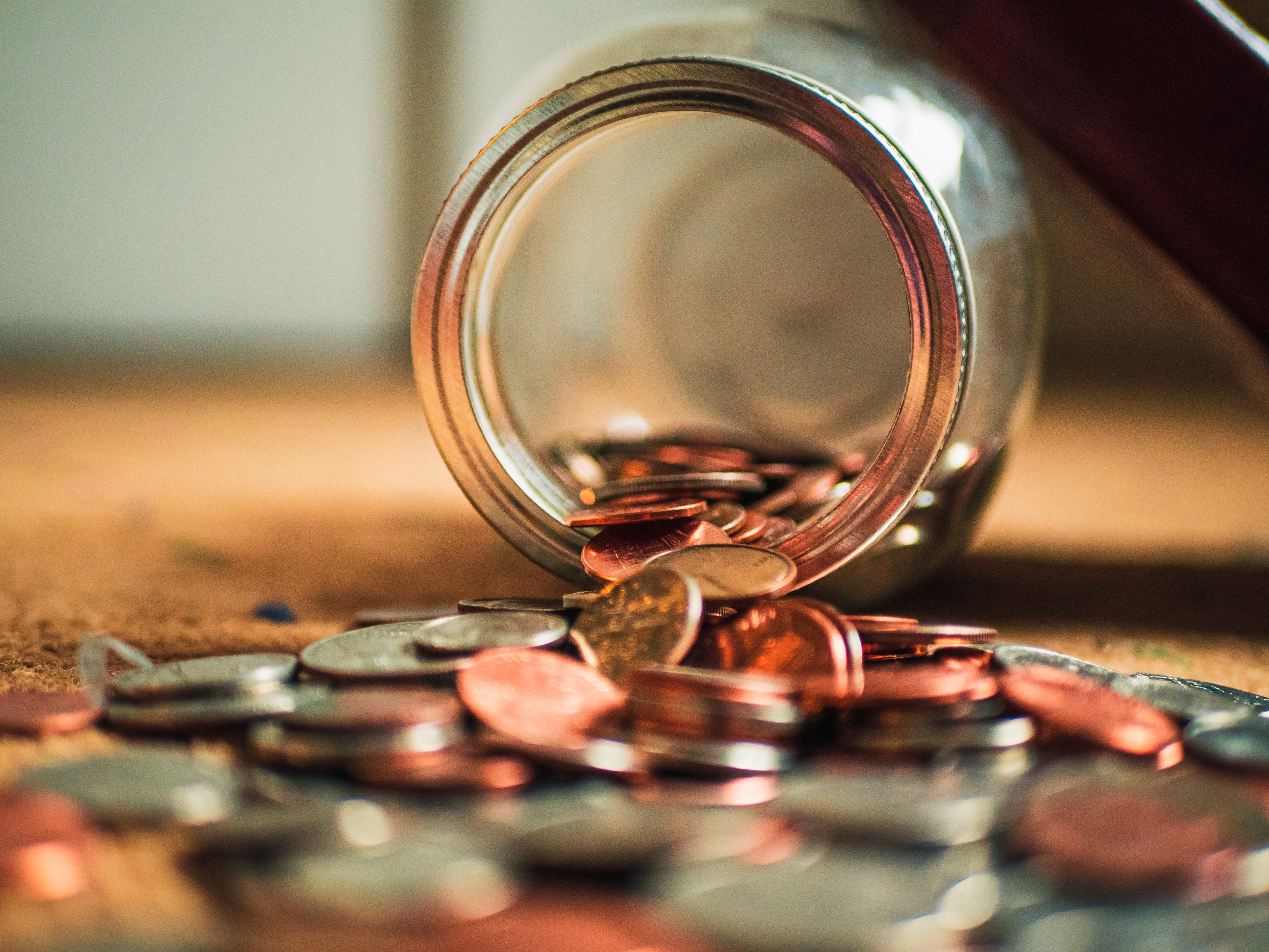 Jar with Coins Falling Out